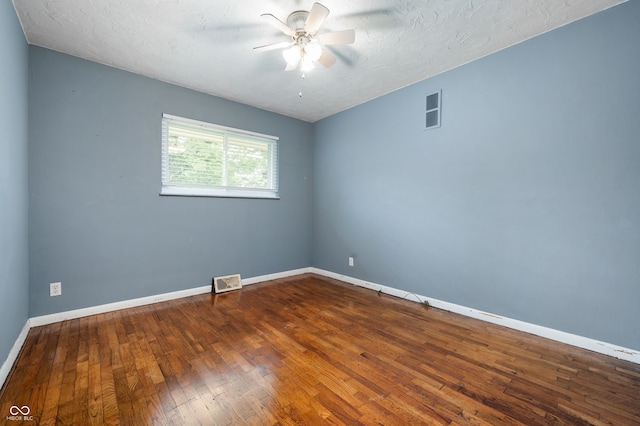 5092 S 50 W, Anderson, IN 46013 - empty room featuring ceiling fan, hardwood / wood-style flooring, baseboards, and a textured ceiling