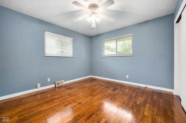 5092 S 50 W, Anderson, IN 46013 - unfurnished room featuring a ceiling fan, hardwood / wood-style floors, baseboards, and a textured ceiling