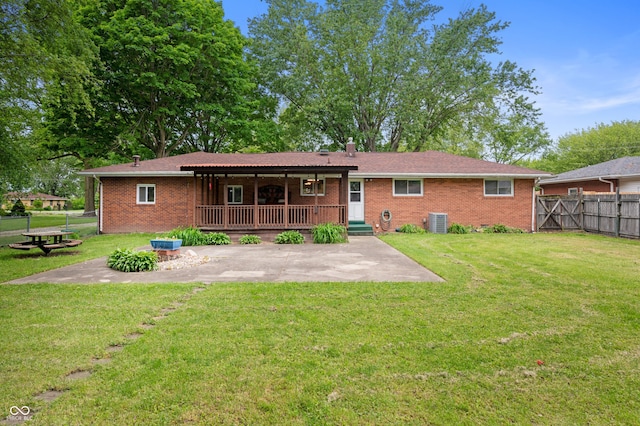 5092 S 50 W, Anderson, IN 46013 - rear view of property with brick siding, a patio area, a chimney, and central AC