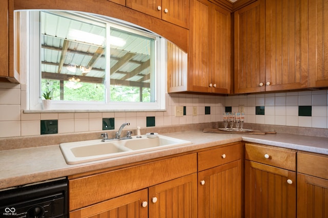 5092 S 50 W, Anderson, IN 46013 - kitchen featuring a sink, brown cabinetry, backsplash, and light countertops