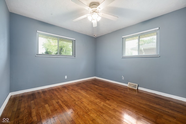 5092 S 50 W, Anderson, IN 46013 - spare room with plenty of natural light, hardwood / wood-style flooring, ceiling fan, and baseboards