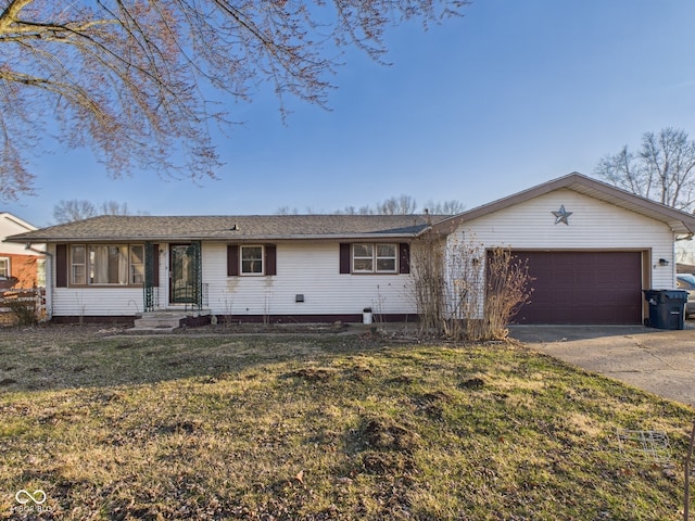 619 Belzer Dr, Anderson, IN 46011 - ranch-style house featuring an attached garage, driveway, and a front lawn