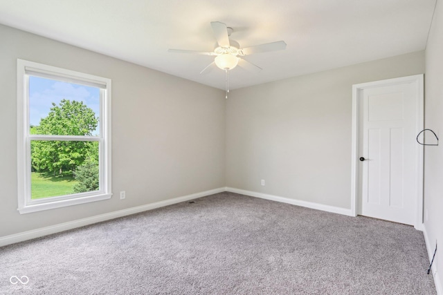 644 Ridge Gate Dr, Brownsburg, IN 46112 - carpeted spare room featuring healthy amount of natural light, baseboards, and a ceiling fan