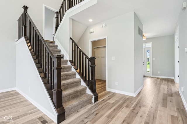 644 Ridge Gate Dr, Brownsburg, IN 46112 - foyer with light wood finished floors, stairway, and baseboards