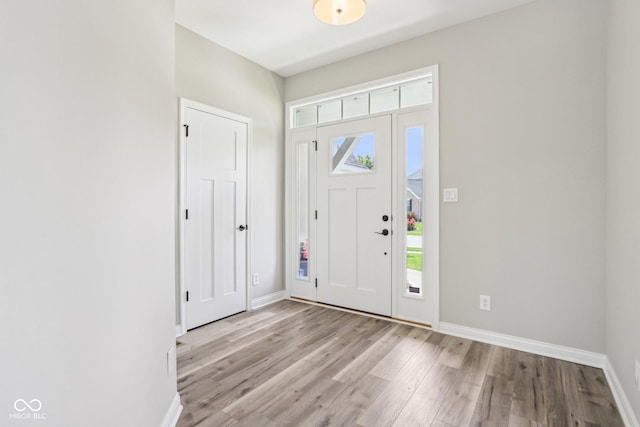 644 Ridge Gate Dr, Brownsburg, IN 46112 - foyer featuring light wood finished floors and baseboards