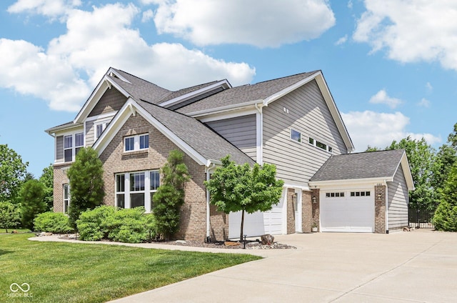 644 Ridge Gate Dr, Brownsburg, IN 46112 - view of front of house featuring driveway, an attached garage, brick siding, a front lawn, and roof with shingles