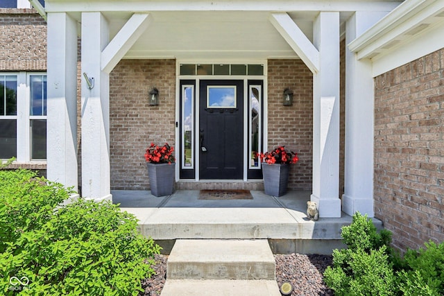 644 Ridge Gate Dr, Brownsburg, IN 46112 - view of exterior entry featuring covered porch and brick siding