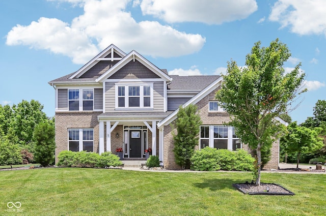 644 Ridge Gate Dr, Brownsburg, IN 46112 - craftsman inspired home featuring a front yard and brick siding