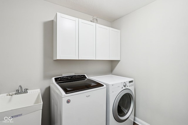 644 Ridge Gate Dr, Brownsburg, IN 46112 - laundry area featuring cabinet space and washer and clothes dryer