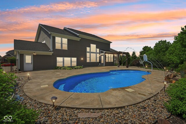 644 Ridge Gate Dr, Brownsburg, IN 46112 - pool at dusk featuring a patio and a pergola