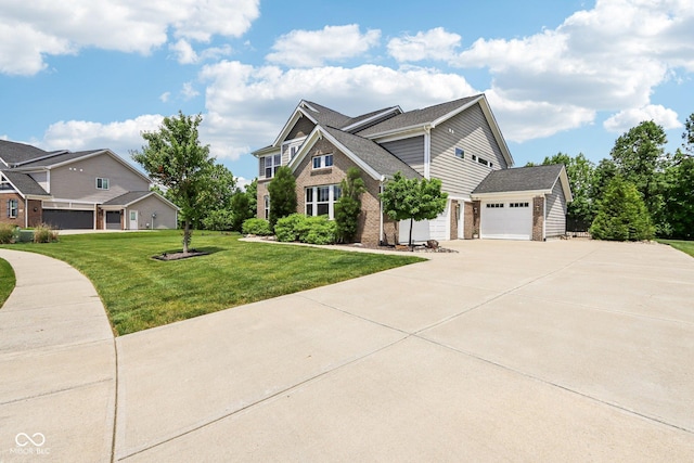 644 Ridge Gate Dr, Brownsburg, IN 46112 - view of front of home with concrete driveway, a front yard, brick siding, and a garage