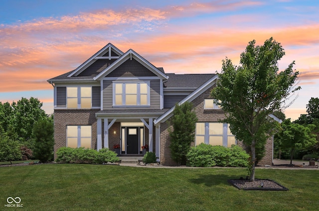 644 Ridge Gate Dr, Brownsburg, IN 46112 - view of front facade with brick siding and a lawn