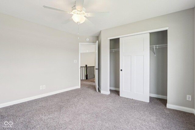 644 Ridge Gate Dr, Brownsburg, IN 46112 - unfurnished bedroom featuring carpet floors, a closet, baseboards, and a ceiling fan