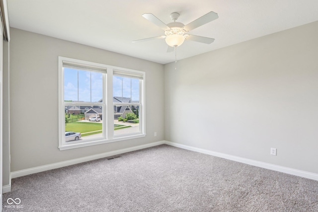 644 Ridge Gate Dr, Brownsburg, IN 46112 - spare room with carpet, baseboards, and a ceiling fan