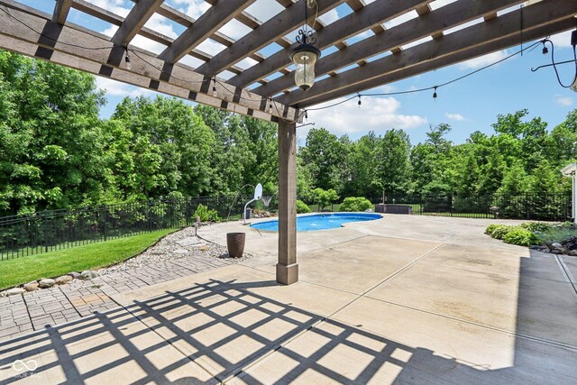 644 Ridge Gate Dr, Brownsburg, IN 46112 - fenced backyard with a pergola, view of wooded area, and a patio