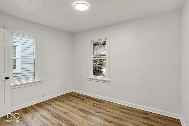 2015 S Hackley St, Muncie, IN 47302 - empty room with light wood finished floors and baseboards