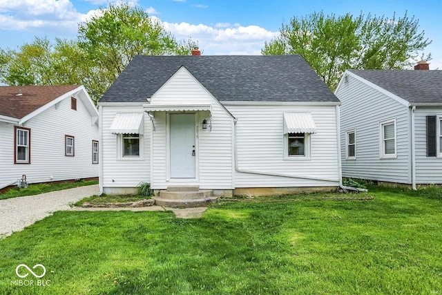 2015 S Hackley St, Muncie, IN 47302 - view of front of home with a front lawn, roof with shingles, and a chimney