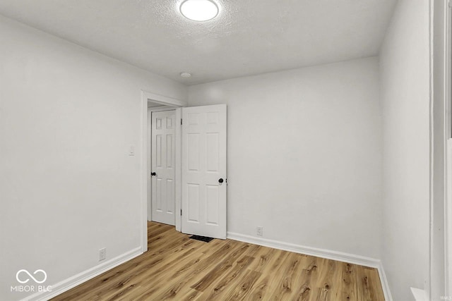 2015 S Hackley St, Muncie, IN 47302 - empty room featuring light wood-style flooring, baseboards, and a smoke detector