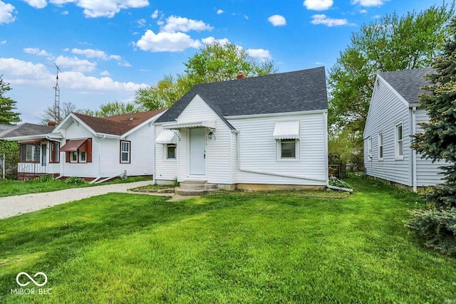 2015 S Hackley St, Muncie, IN 47302 - view of front of home featuring a front yard, roof with shingles, a chimney, and gravel driveway