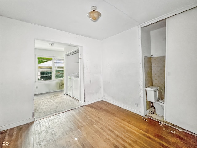 3615 N Dequincy St, Indianapolis, IN 46218 - unfurnished bedroom with wood-type flooring and baseboards