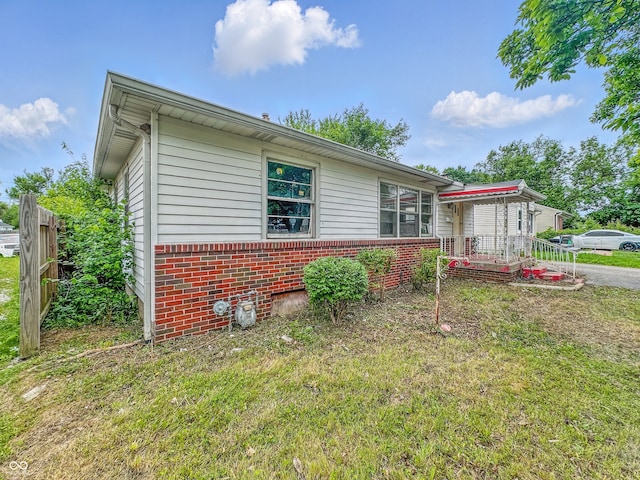 3615 N Dequincy St, Indianapolis, IN 46218 - view of side of home with brick siding