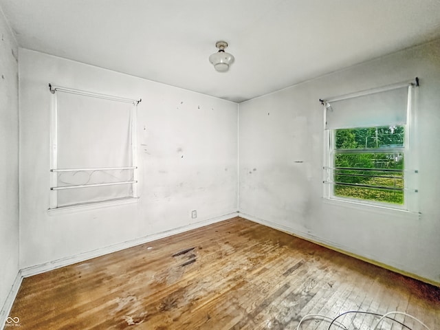 3615 N Dequincy St, Indianapolis, IN 46218 - empty room featuring wood-type flooring and baseboards