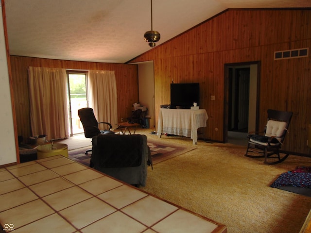 2625 S 200 E, Lebanon, IN 46052 - carpeted living area featuring wood walls and vaulted ceiling