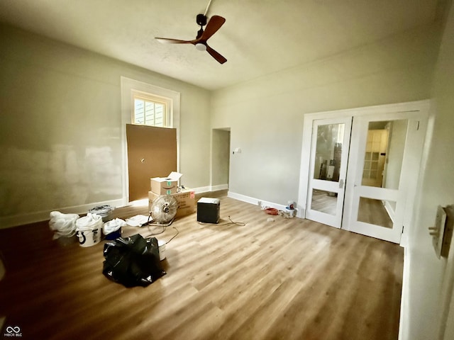 621 E Main St, Muncie, IN 47305 - unfurnished bedroom with wood finished floors, baseboards, and ceiling fan