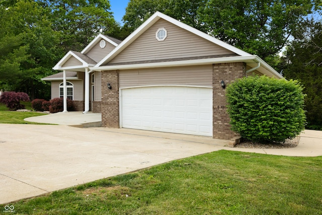 435 Cedar View Ln, Bedford, IN 47421 - view of front facade with brick siding, driveway, a garage, and a front lawn