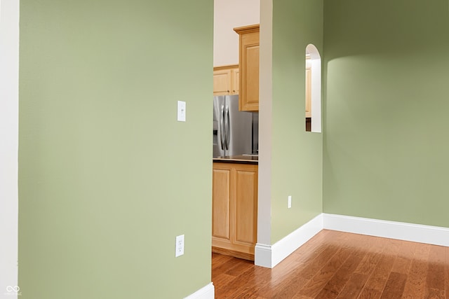 435 Cedar View Ln, Bedford, IN 47421 - spare room featuring wood finished floors, baseboards, and arched walkways