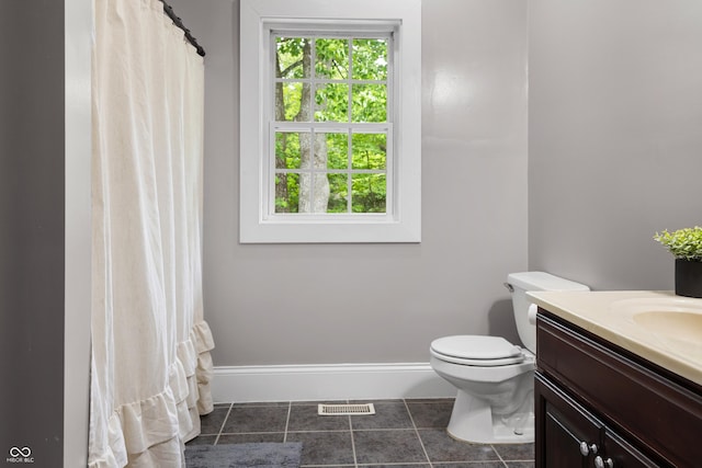 435 Cedar View Ln, Bedford, IN 47421 - bathroom featuring vanity, toilet, baseboards, tile patterned floors, and a shower with shower curtain