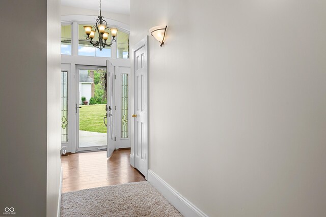 435 Cedar View Ln, Bedford, IN 47421 - doorway featuring a chandelier, wood finished floors, and baseboards