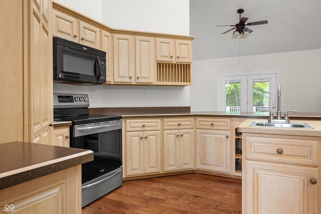 435 Cedar View Ln, Bedford, IN 47421 - kitchen featuring black microwave, stainless steel electric range oven, a ceiling fan, dark countertops, and wood finished floors