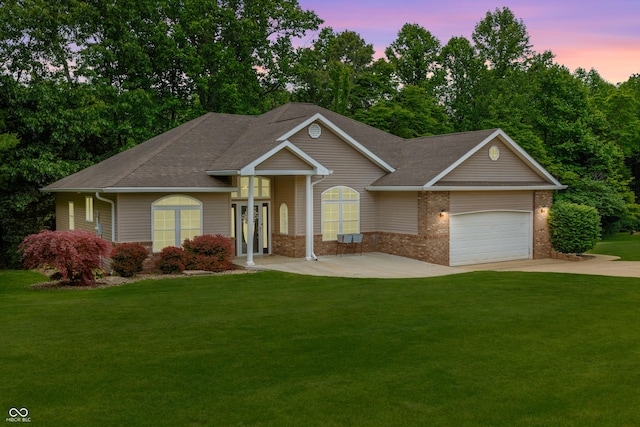435 Cedar View Ln, Bedford, IN 47421 - ranch-style home featuring brick siding, a front yard, and an attached garage
