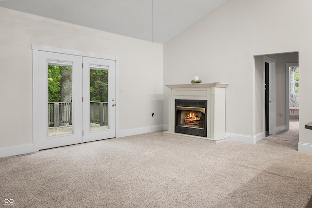 435 Cedar View Ln, Bedford, IN 47421 - unfurnished living room with carpet, a glass covered fireplace, baseboards, and high vaulted ceiling
