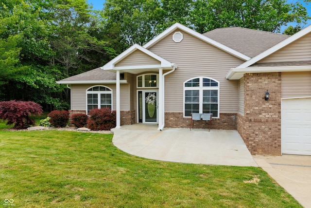 435 Cedar View Ln, Bedford, IN 47421 - traditional-style house with an attached garage, brick siding, a front yard, a shingled roof, and concrete driveway