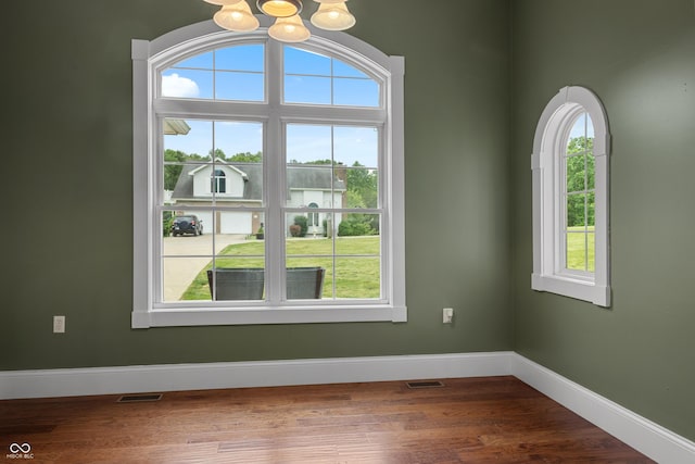 435 Cedar View Ln, Bedford, IN 47421 - spare room with a chandelier, wood finished floors, and baseboards