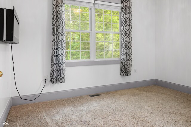 435 Cedar View Ln, Bedford, IN 47421 - spare room featuring carpet flooring and baseboards