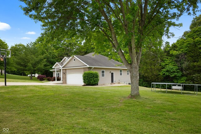 435 Cedar View Ln, Bedford, IN 47421 - view of front facade with a front lawn, a garage, and driveway