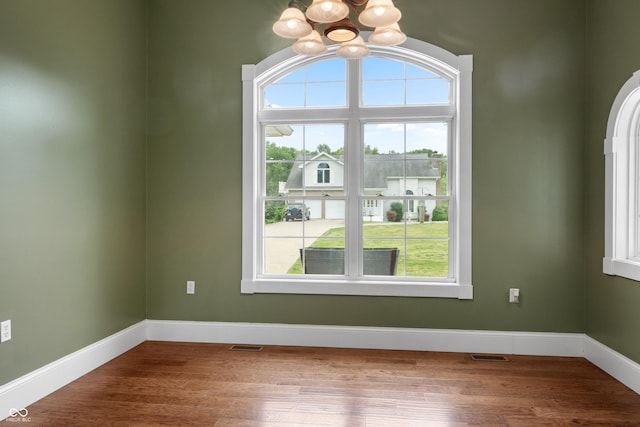 435 Cedar View Ln, Bedford, IN 47421 - unfurnished room with a chandelier, wood finished floors, and baseboards