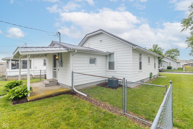 1310 N Cherry St, Rushville, IN 46173 - rear view of property with a metal roof