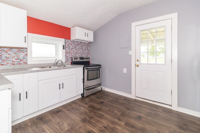 1310 N Cherry St, Rushville, IN 46173 - kitchen featuring stainless steel electric range, backsplash, lofted ceiling, white cabinets, and dark wood-style flooring