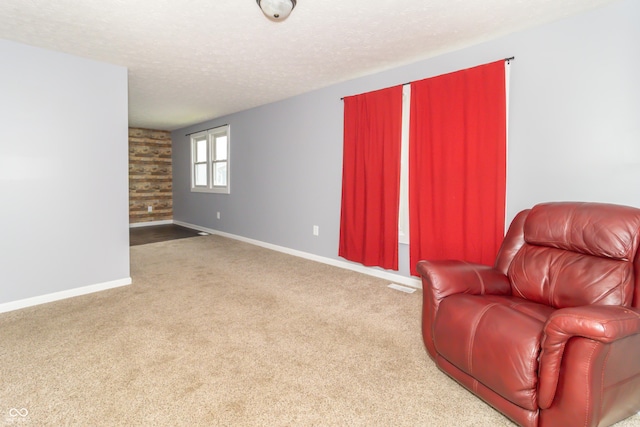 1310 N Cherry St, Rushville, IN 46173 - sitting room with carpet and a textured ceiling