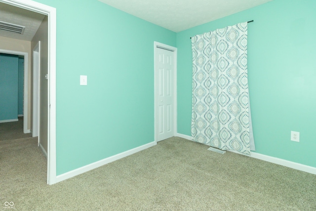 1310 N Cherry St, Rushville, IN 46173 - carpeted spare room with baseboards