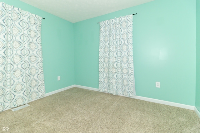 1310 N Cherry St, Rushville, IN 46173 - carpeted spare room with baseboards