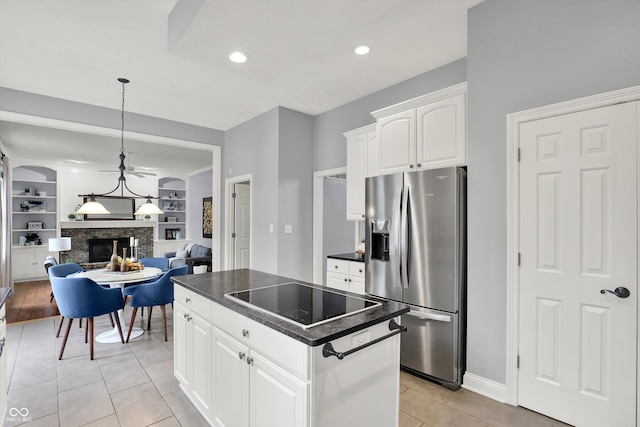 1410 Shadow Ct, Zionsville, IN 46077 - kitchen with stainless steel fridge with ice dispenser, dark countertops, black electric stovetop, a brick fireplace, and open floor plan