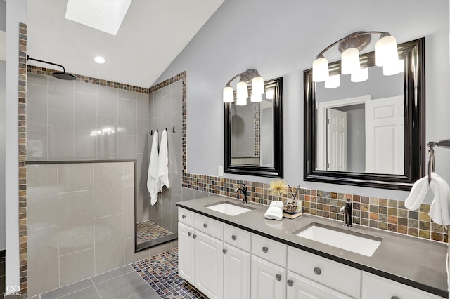 1410 Shadow Ct, Zionsville, IN 46077 - full bathroom featuring lofted ceiling, a skylight, walk in shower, double vanity, and tile patterned flooring