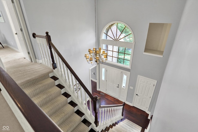 1410 Shadow Ct, Zionsville, IN 46077 - entrance foyer featuring a high ceiling, a chandelier, wood finished floors, and stairs