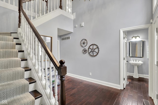 1410 Shadow Ct, Zionsville, IN 46077 - staircase featuring a high ceiling and wood finished floors