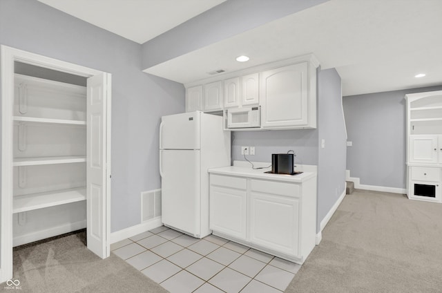 1410 Shadow Ct, Zionsville, IN 46077 - kitchen with white appliances, white cabinetry, light carpet, and recessed lighting